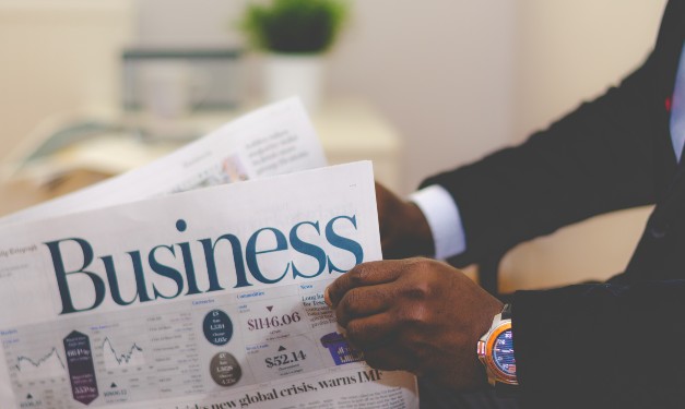 Man reading business newspaper