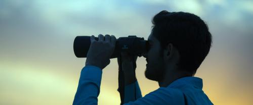 Man with binoculars