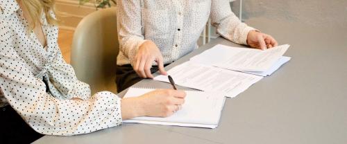 Two people writing a report