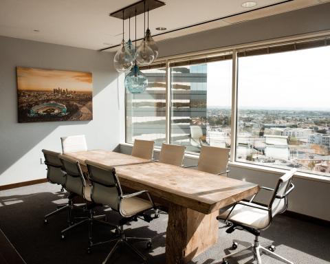 An empty boardroom in a sunny skyscraper