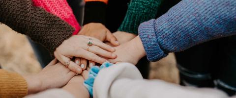 Group with hands together