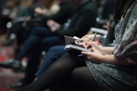 People attend a conference